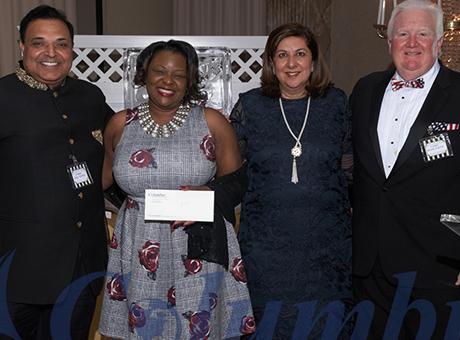 Columbus CEO, President and Program Manager present and award to an employee