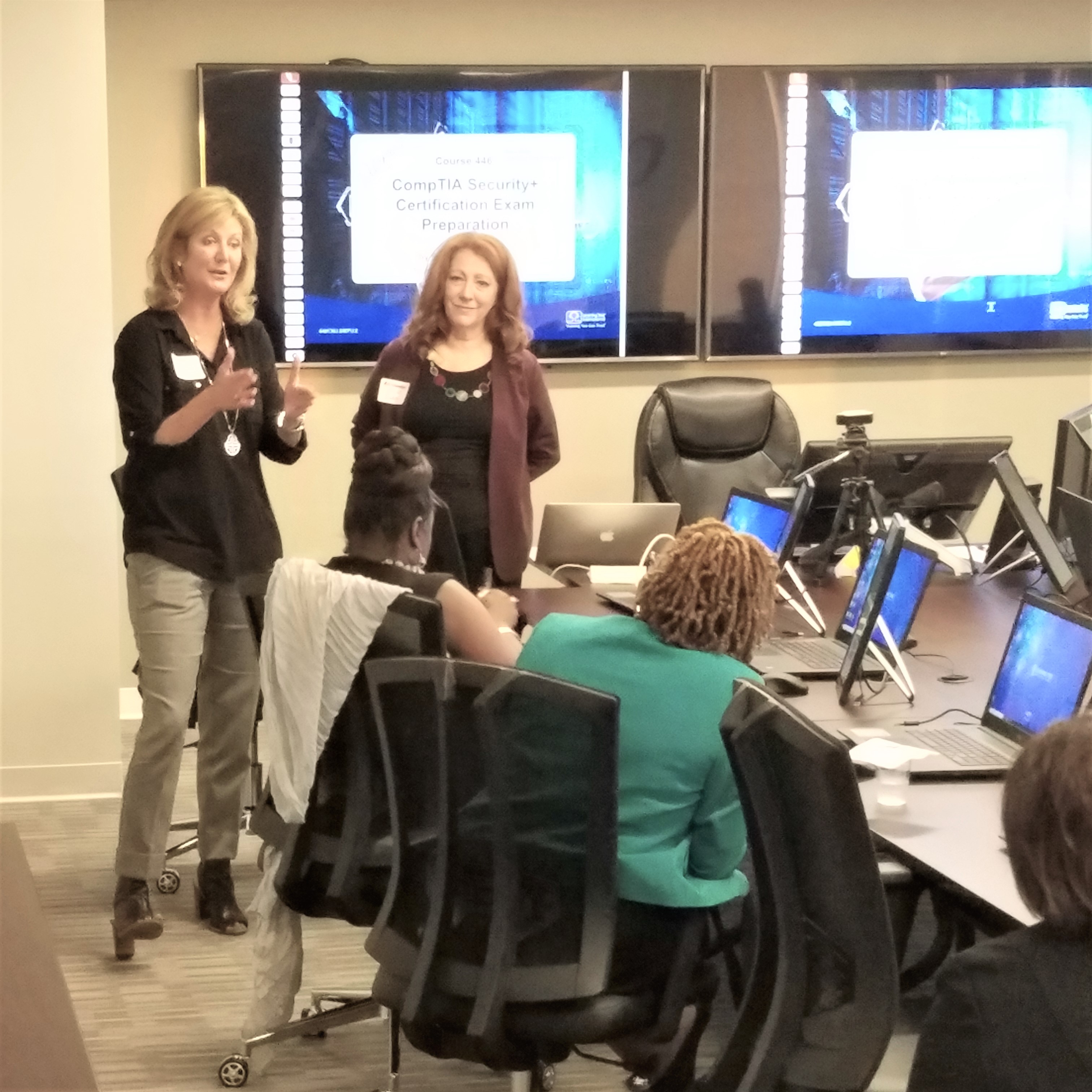 Female instructing computer class